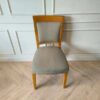 Wooden chair, cream colored fabric cushion, beautiful design.