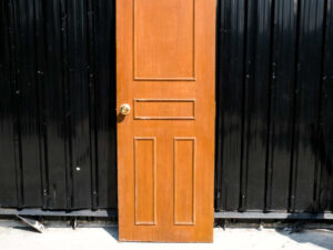 Wooden door, solid mullion door, hinges, gold knobs.