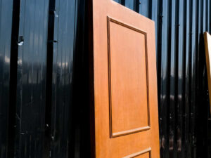 Wooden door, solid mullion door, hinges, gold knobs.