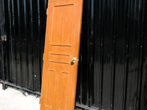 Wooden door, solid mullion door, hinges, gold knobs.