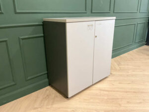 Filing cabinet, storage cabinet, wooden frame, white surface.