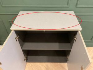 Filing cabinet, storage cabinet, wooden frame, white surface.