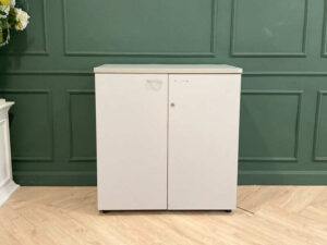 Filing cabinet, storage cabinet, wooden frame, white surface.