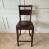 Wooden chair, dark brown dining chair, beautiful design, slightly curved backrest.