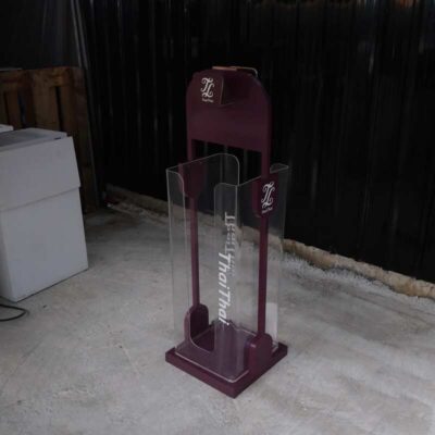 Tall product holder Product display box, red-purple color, attached to clear acrylic.
