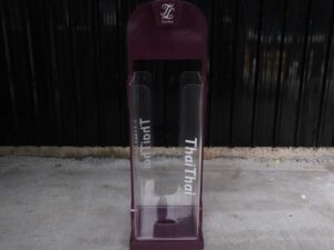 Tall product holder Product display box, red-purple color, attached to clear acrylic.