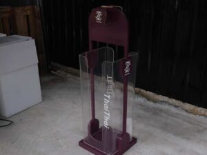 Tall product holder Product display box, red-purple color, attached to clear acrylic.