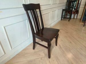 Whole chair made of wood, beautiful frame, dark brown.