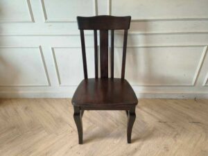 Whole chair made of wood, beautiful frame, dark brown.