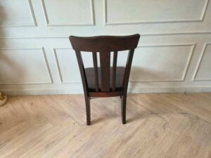Whole chair made of wood, beautiful frame, dark brown.