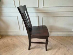 Whole chair made of wood, beautiful frame, dark brown.
