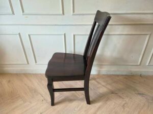 Whole chair made of wood, beautiful frame, dark brown.