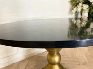 Round table, stainless steel legs, gold color, black wooden top