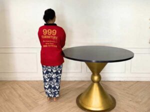 Round table, stainless steel legs, gold color, black wooden top