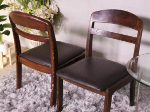 Wooden chair with dark brown fabric cushion, beautiful design.