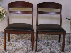 Wooden chair with dark brown fabric cushion, beautiful design.