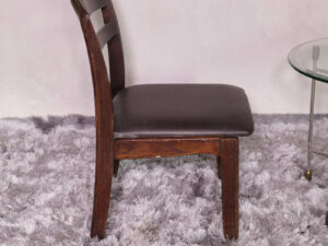 Wooden chair with dark brown fabric cushion, beautiful design.