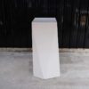 Pallet Tall product display stand with white wooden frame all over.