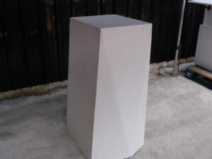 Pallet Tall product display stand with white wooden frame all over.