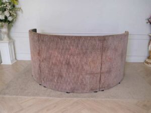 Semi-circular reception counter, cloth covered, wooden frame, brown.