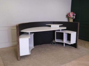 Semi-circular reception counter, cloth covered, wooden frame, brown.