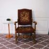 Carved chair, brown fabric cushion, European work from Germany.