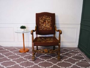 Carved chair, brown fabric cushion, European work from Germany.