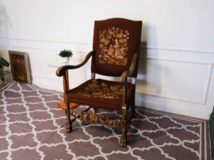Carved chair, brown fabric cushion, European work from Germany.