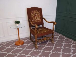 Carved chair, brown fabric cushion, European work from Germany.