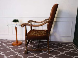 Carved chair, brown fabric cushion, European work from Germany.