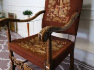 Carved chair, brown fabric cushion, European work from Germany.