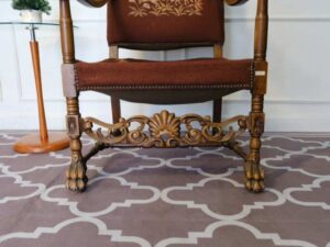 Carved chair, brown fabric cushion, European work from Germany.