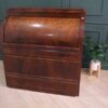 Cylindrical wooden storage cabinet, antique style, European work from Germany.