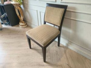 Wooden chair, cream-colored fabric cushion with straight lines. Beautiful frame, dark brown. The backrest has a cushion.