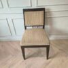 Wooden chair, cream-colored fabric cushion with straight lines. Beautiful frame, dark brown. The backrest has a cushion.
