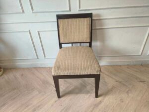 Wooden chair, cream-colored fabric cushion with straight lines. Beautiful frame, dark brown. The backrest has a cushion.
