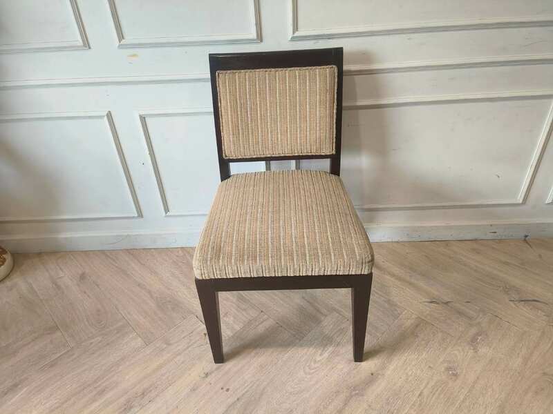 Wooden chair, cream-colored fabric cushion with straight lines. Beautiful frame, dark brown. The backrest has a cushion.