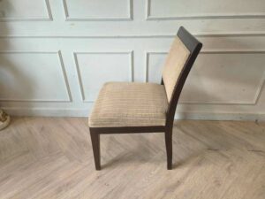 Wooden chair, cream-colored fabric cushion with straight lines. Beautiful frame, dark brown. The backrest has a cushion.