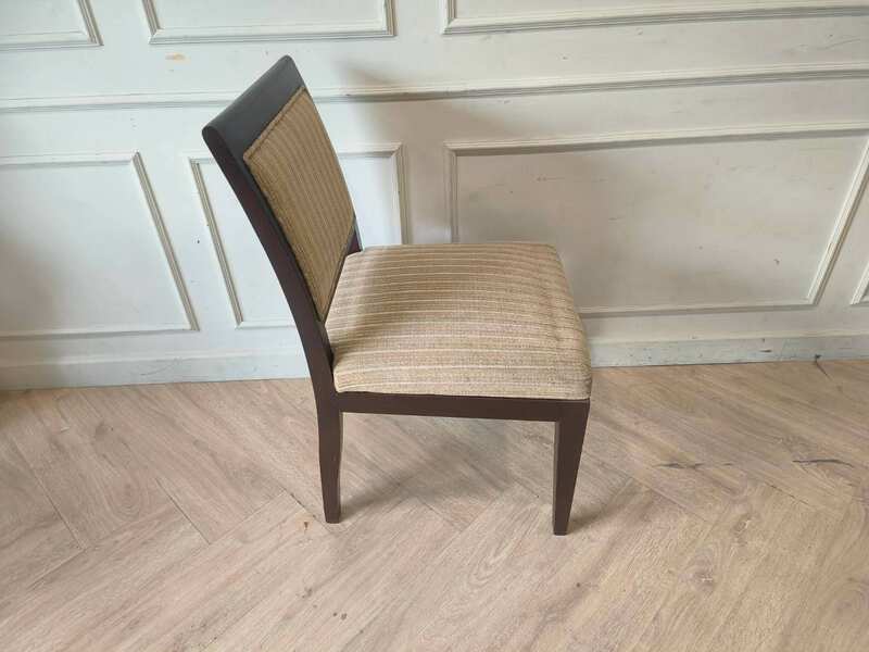 Wooden chair, cream-colored fabric cushion with straight lines. Beautiful frame, dark brown. The backrest has a cushion.