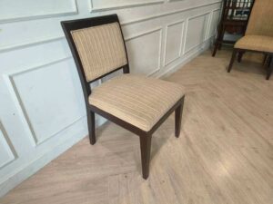 Wooden chair, cream-colored fabric cushion with straight lines. Beautiful frame, dark brown. The backrest has a cushion.