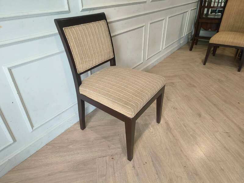Wooden chair, cream-colored fabric cushion with straight lines. Beautiful frame, dark brown. The backrest has a cushion.