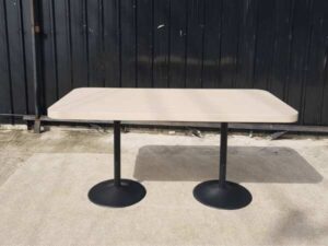Dining table, black round steel legs, cream wood top, 160 x 80 cm.