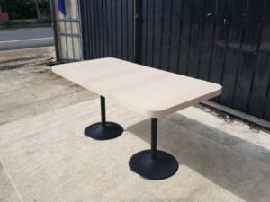 Dining table, black round steel legs, cream wood top, 160 x 80 cm.