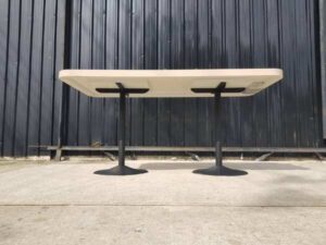 Dining table, black round steel legs, cream wood top, 160 x 80 cm.