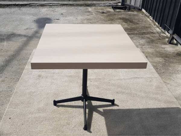 Dining table, steel legs, wooden top, cream color, 80 x 80 cm.