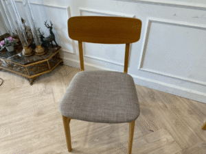 Gray wooden chair with fabric cushion, modern style