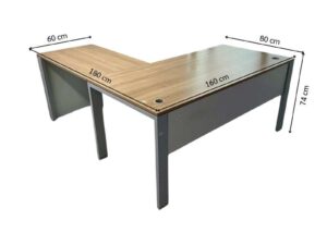 L-shaped corner desk with steel legs and light brown wood top, includes power strip. PROFLEX brand.