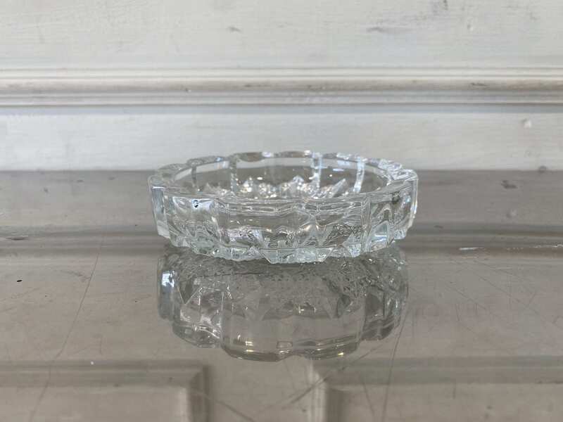 Thick, round crystal ashtray.