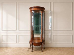 Glass display case with curved glass doors and a classic wooden frame.