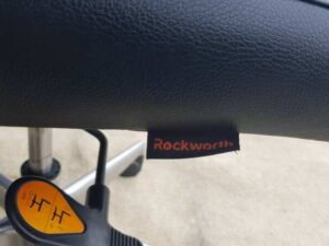 Office chair, steel legs, leather seat, black backrest, Rockworth brand.
